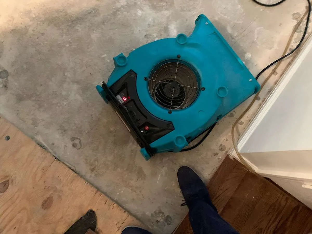 Air mover drying subfloor during Commercial Water Damage Restoration in Pooler
